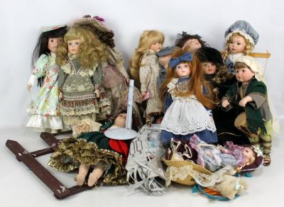 Twelve modern porcelain dolls including Alberon examples and one housed in carry case all in various outfits. Adam Partridge