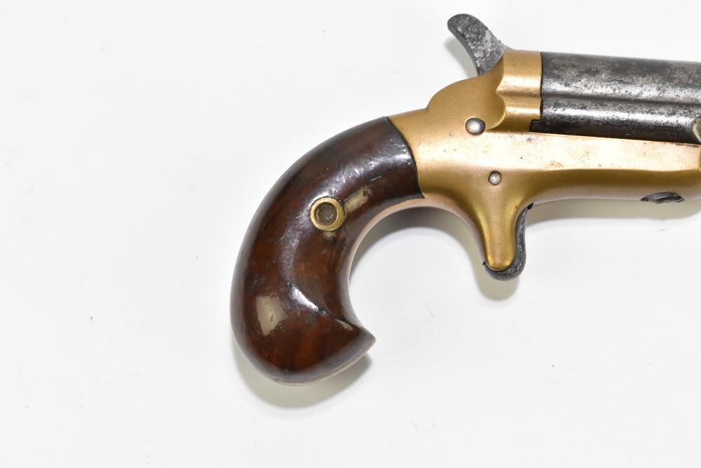 COLT; a Derringer .41 rimfire pocket pistol with brass frame and steel  barrel, inscribed with the maker's name to the of of the barrel, overall  length 12cm. Provenance: The Captain Allan Marshall