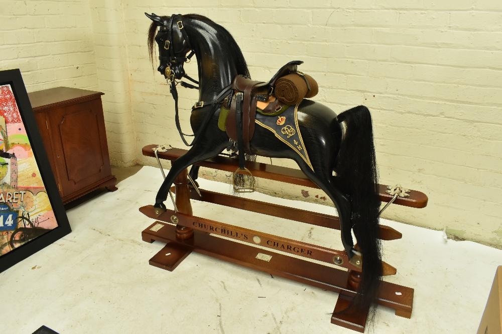 STEVENSON BROTHERS a good and rare Churchill s Charger rocking horse in English oak with military style saddle and tack based of that of the 4th Hussars with bedroll and hand embroidered Shabraq