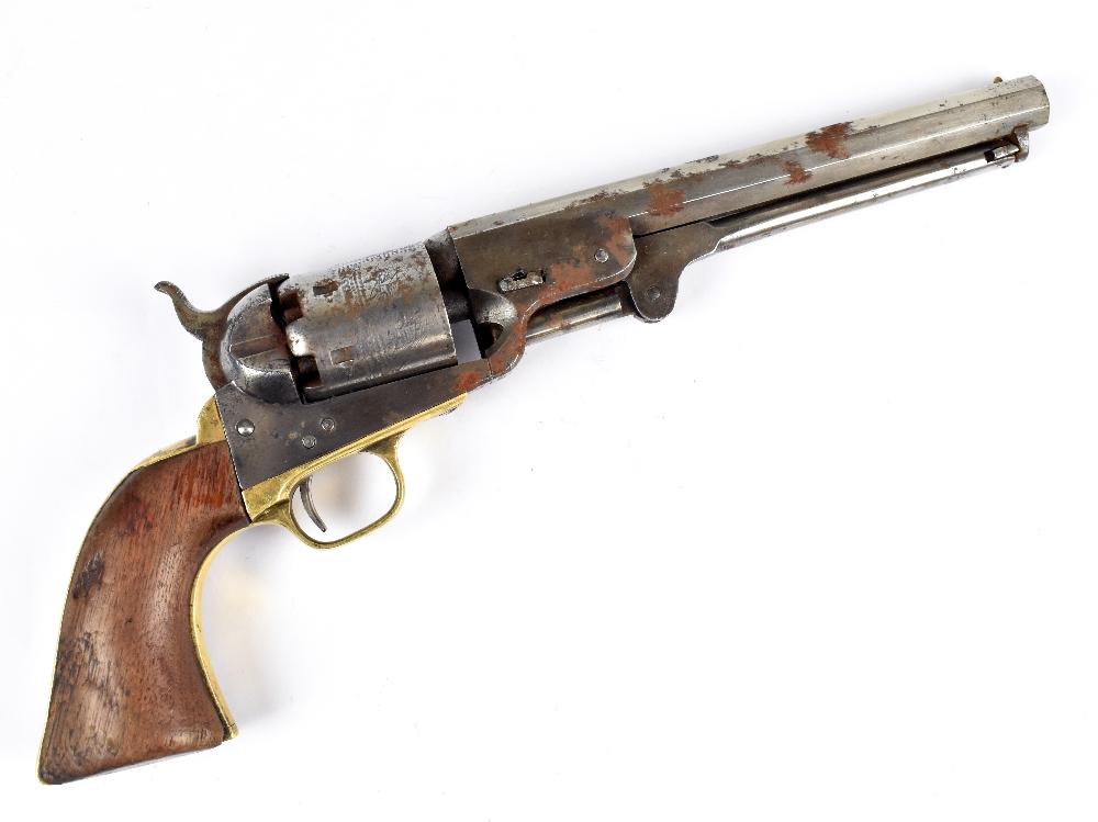 A Colt Patent New Navy Model .36 six shot percussion cap single action  revolver with 7.5 octagonal barrel and mounted with brass strapwork and  walnut grips, the cylinder with Naval engraving and stamped 'Colt's Patent  No.9087' the barrel flat further