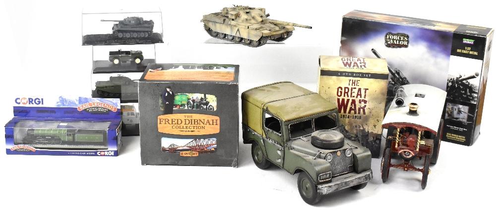 A collection of military themed collectibles to include various scale diecast military vehicles mostly tanks and Land Rovers a 4x4 Land Rover themed mug in box a collection of The Great War