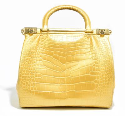 Sold at Auction: KWANPEN YELLOW LEATHER HANDBAG