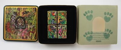 A Zippo 1995 Limited Edition Collectors Set Of Mysteries Of The Forest Lighters Four Lighters Contained In A Collectors Tin Featuring Forest Animals Insects Flora Fauna Etc And A Zippo 1995 Limited Edition Lighter Companion Piece To The 1995 Limited Edition Set