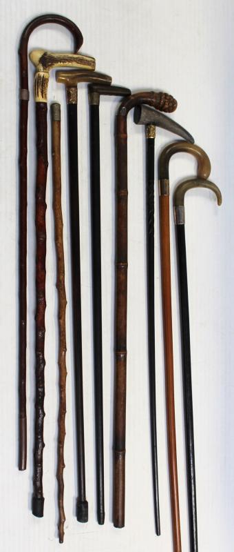 A collection of vintage walking sticks to include examples with horn ...