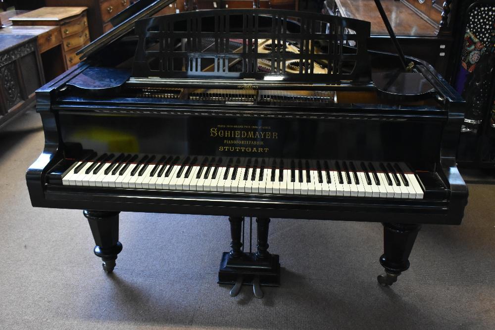 SCHIEDMAYER a circular 1900 05 ebonised grand piano the fall board inscribed in gilt Paris 1900 Grand Prix 1904 St Louis Schiedmayer Stuttart on turned column legs width 150cm length 186cm height 99cm...