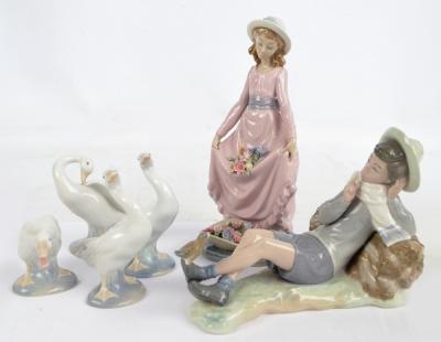 A collection of Lladro and Nao figures comprising, Lladro 'Gone