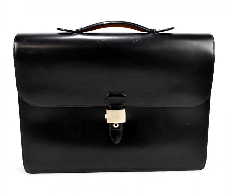 DUNHILL; a vintage black leather Dunhill briefcase, with tan leather ...