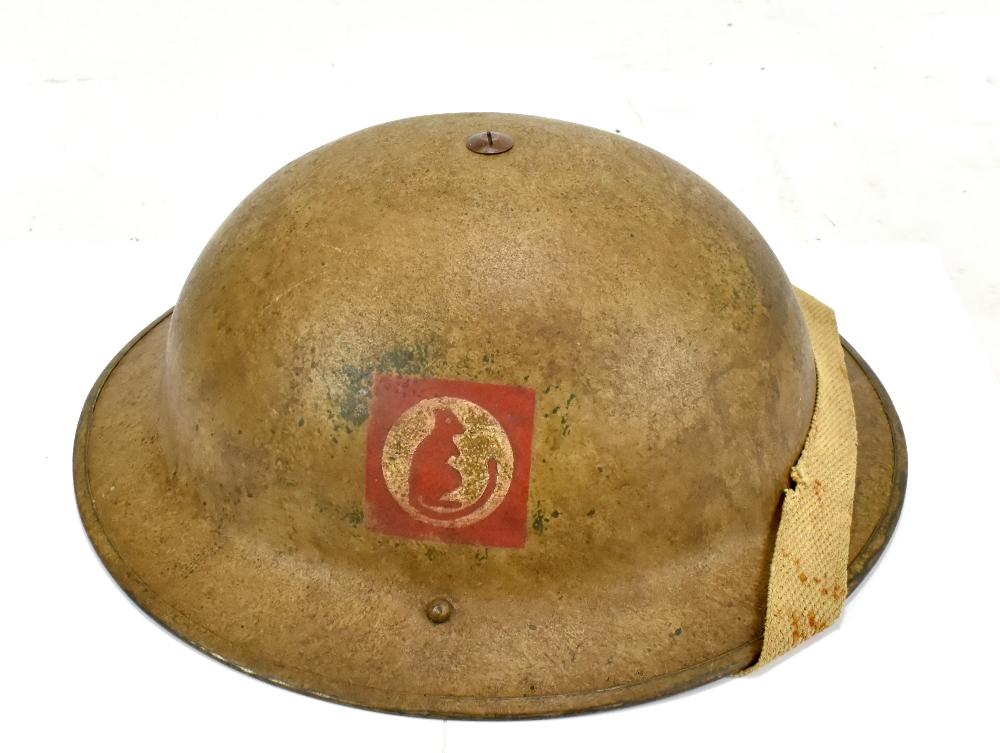 A WWII British Desert Rat Brodie helmet with rare original decal